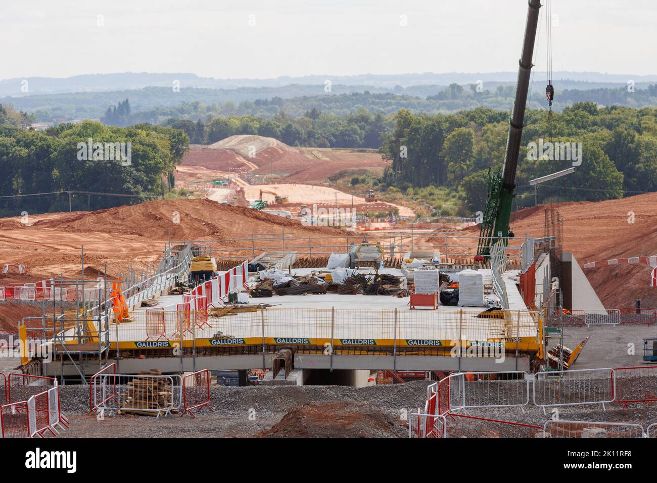 The section of the HS2 rail network being built near Burton Green in Warwickshire. The line goes through the centre of Burton Green, going under Cromwell Lane via a tunnel. The tunnel is called a cut and shut, constructed by making the sides and then adding a top covering layer to form the tunnel. Picture shows the view from Cromwell Lane looking towards Kenilworth after part of the tunnel construction has been completed. Stock Photo
