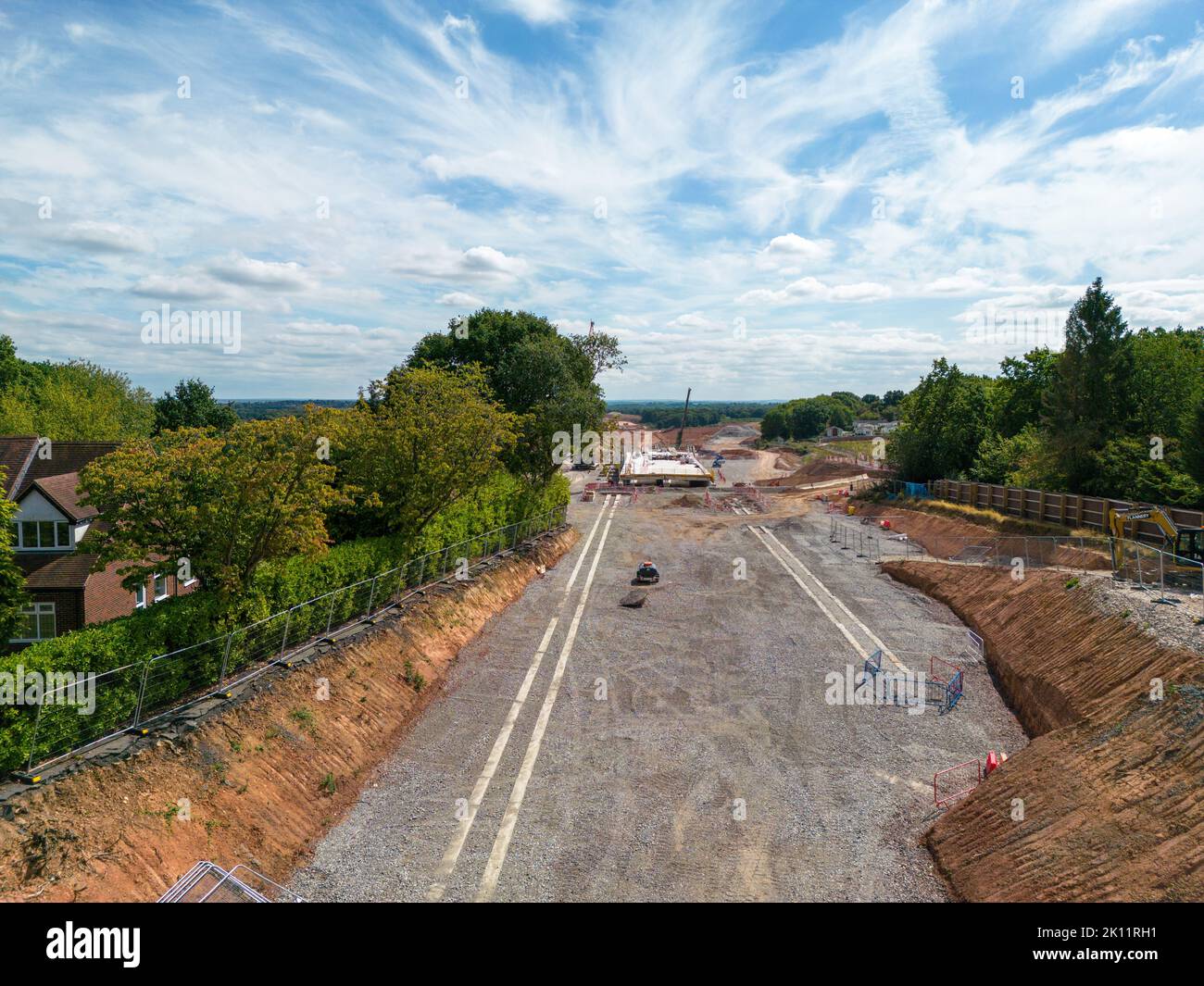 The section of the HS2 rail network being built near Burton Green in Warwickshire. The line goes through the centre of Burton Green, going under Cromwell Lane via a tunnel. The tunnel is called a cut and shut, constructed by making the sides and then adding a top covering layer to form the tunnel. Picture shows the view from Cromwell Lane looking towards Kenilworth after part of the tunnel construction has been completed. Stock Photo