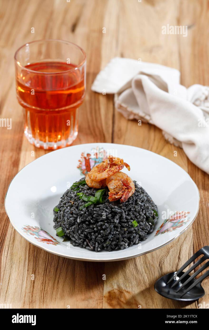 Nasi Goreng Cumi Hitam, Black Squid Ink Fried Rice. Indonesian Food Stock Photo