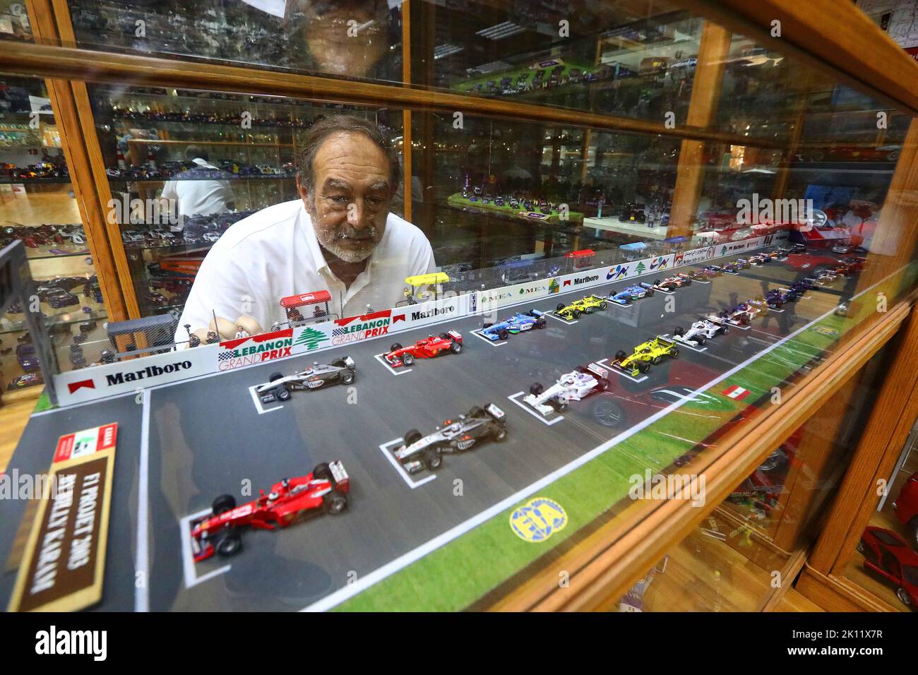 Beirut, Lebanon. 12th Sep, 2022. Nabil Karam looks at his collections at Billy Karam Museum in Zouk Mosbeh, Lebanon, Sept. 12, 2022. Lebanese race car champion Nabil Karam started his hobby of collecting mini sports cars 30 years ago. Today, the 65-year-old man has collected around 50,000 car miniatures from around the world. TO GO WITH 'Feature: Lebanese racer turns hobby into car museum' Credit: Bilal Jawich/Xinhua/Alamy Live News Stock Photo
