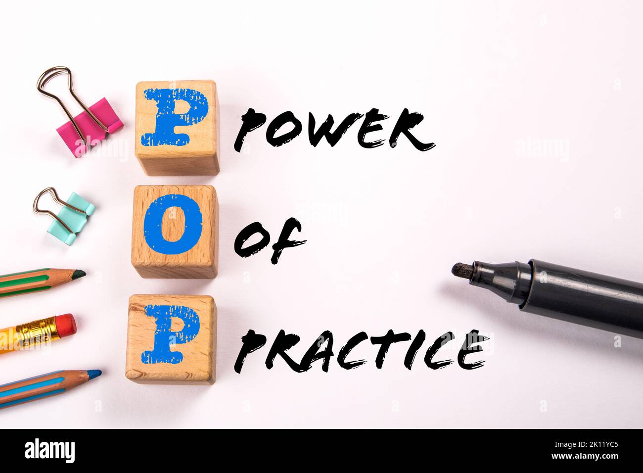 POP - Power Of Practice. Black marker on white background. Stock Photo