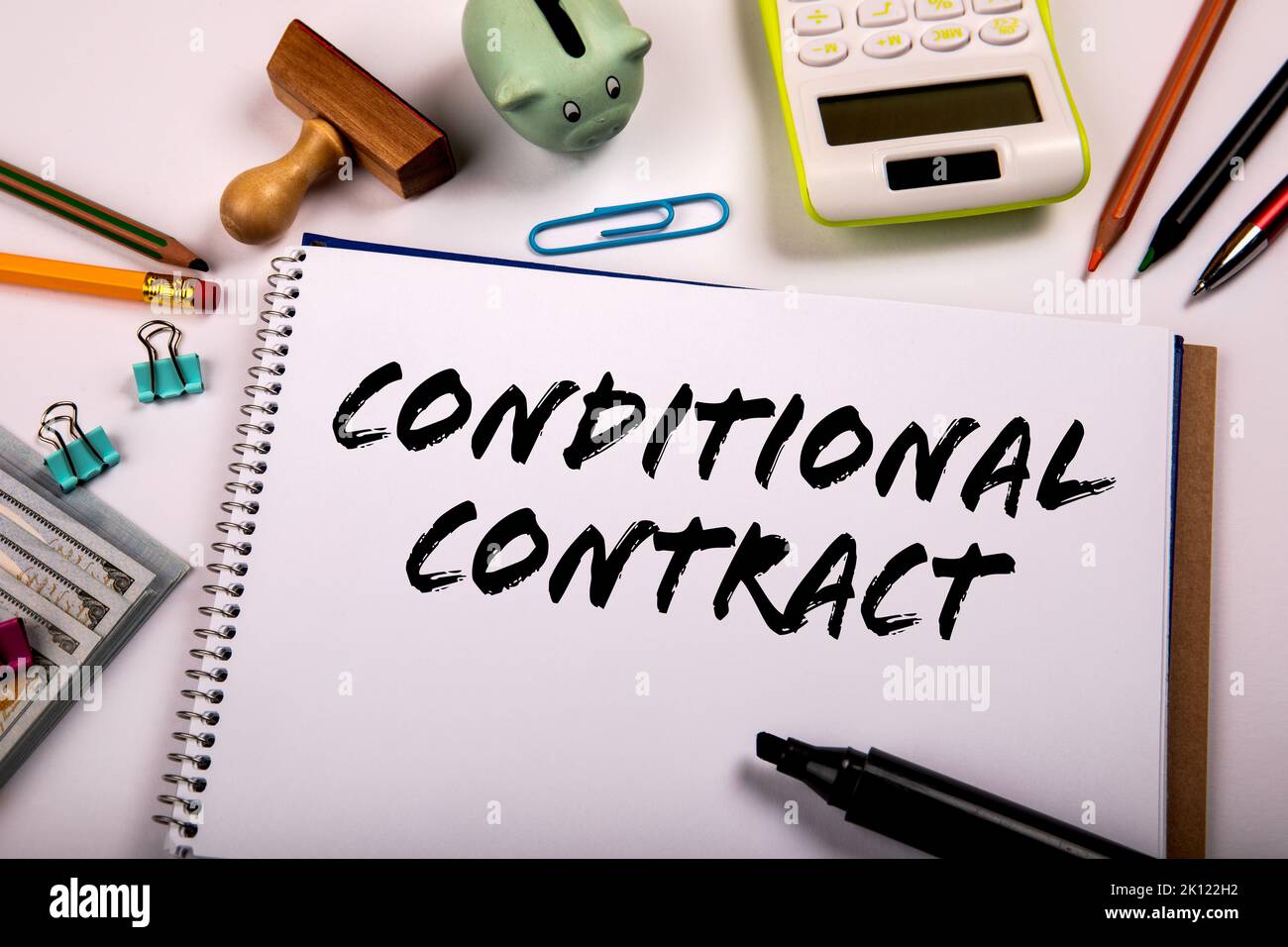 Conditional Contract. Conditional Contract text written on a notebook. Office supplies on a white background. Stock Photo