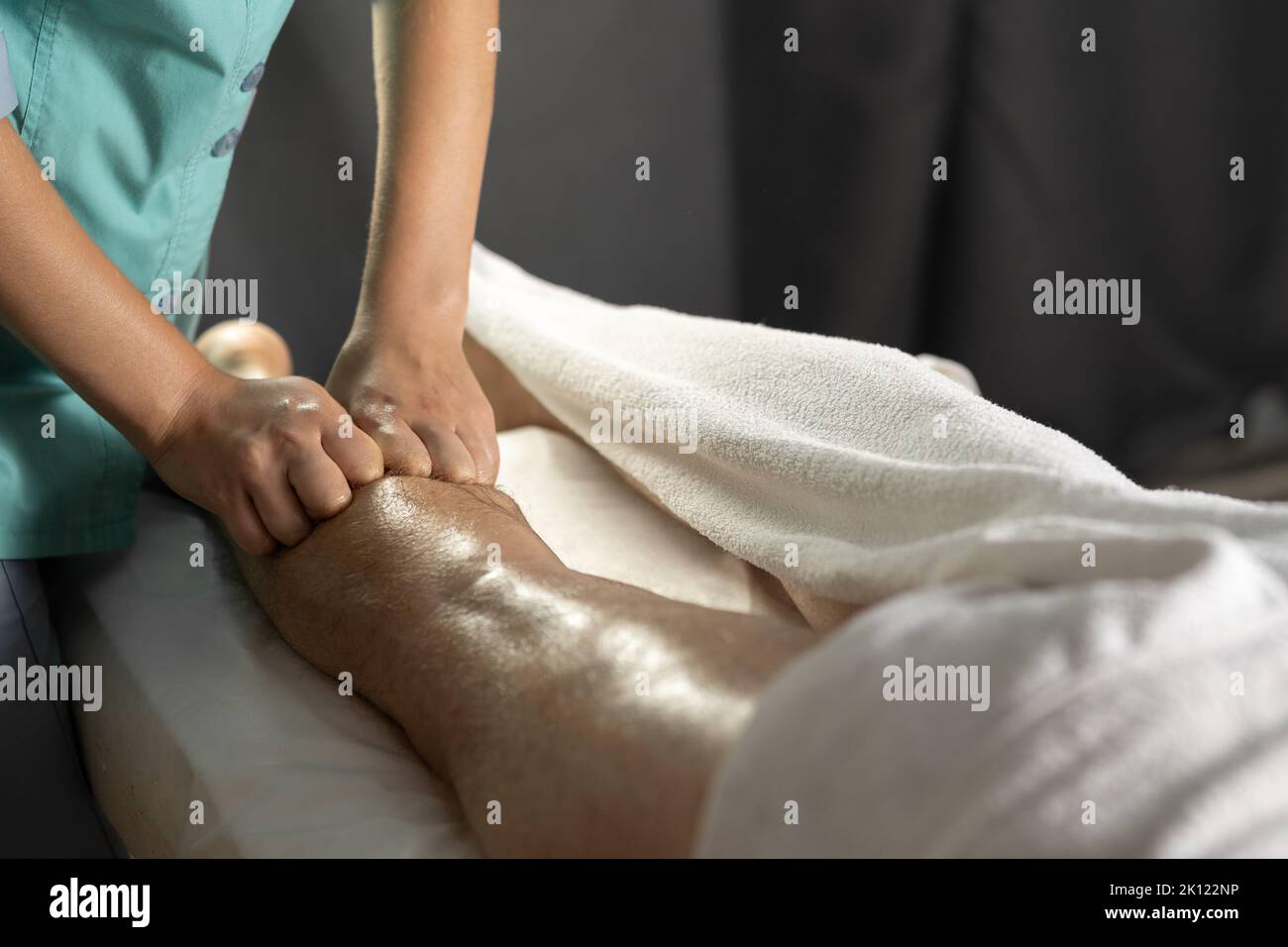 Sports massage. Massage and rehabilitation. Masseur massaged his calf. Stock Photo