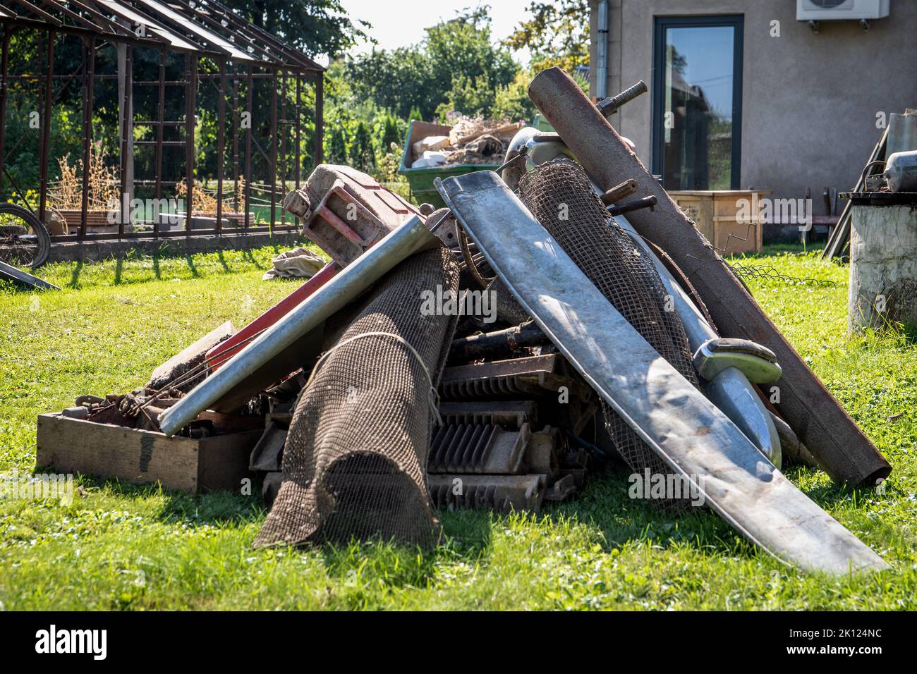 Scrap metal collection. Dirty backyard. Pickers and collectors. Stock Photo