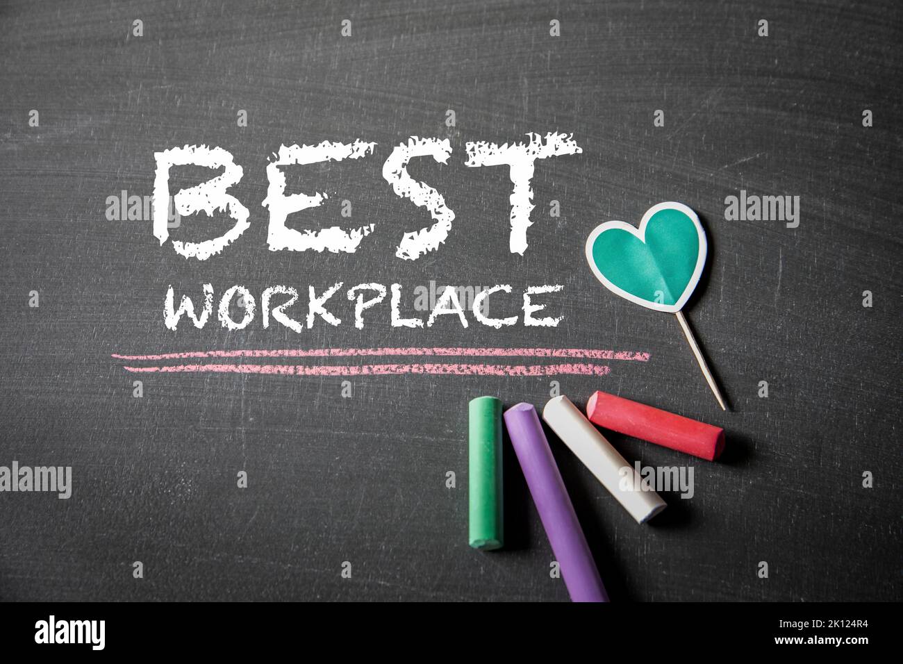 BEST WORKPLACE. Text on black chalk board. Stock Photo