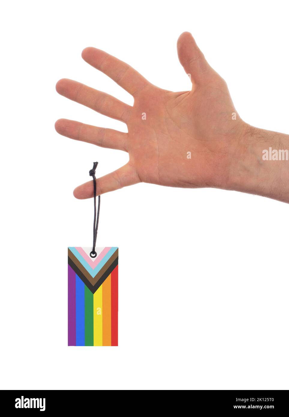 Adult hand isolated with a label - The Progress LGBTQ Rainbow flag Stock Photo