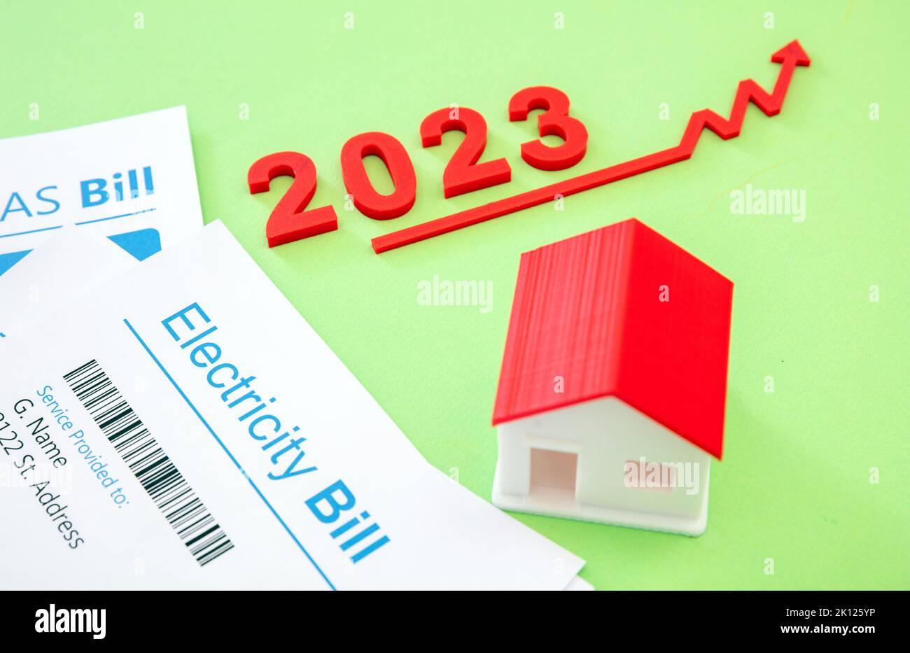 Home electricity heating and water cost increase in 2023. House model