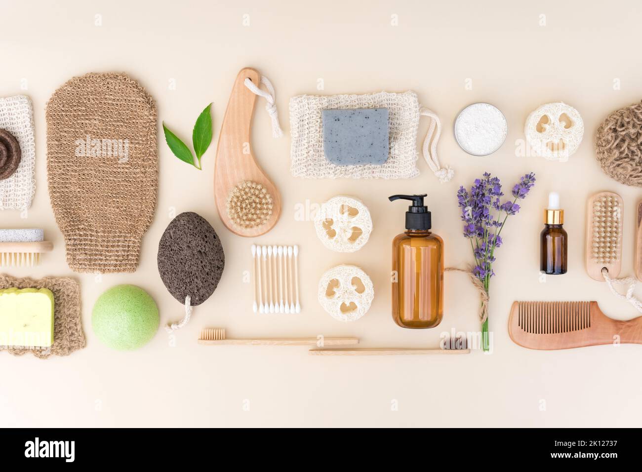 Self-care products, herbal cosmetics for bodycare and skin care with lavender flowers. Natural bath accessories bundle over light background. Eco livi Stock Photo