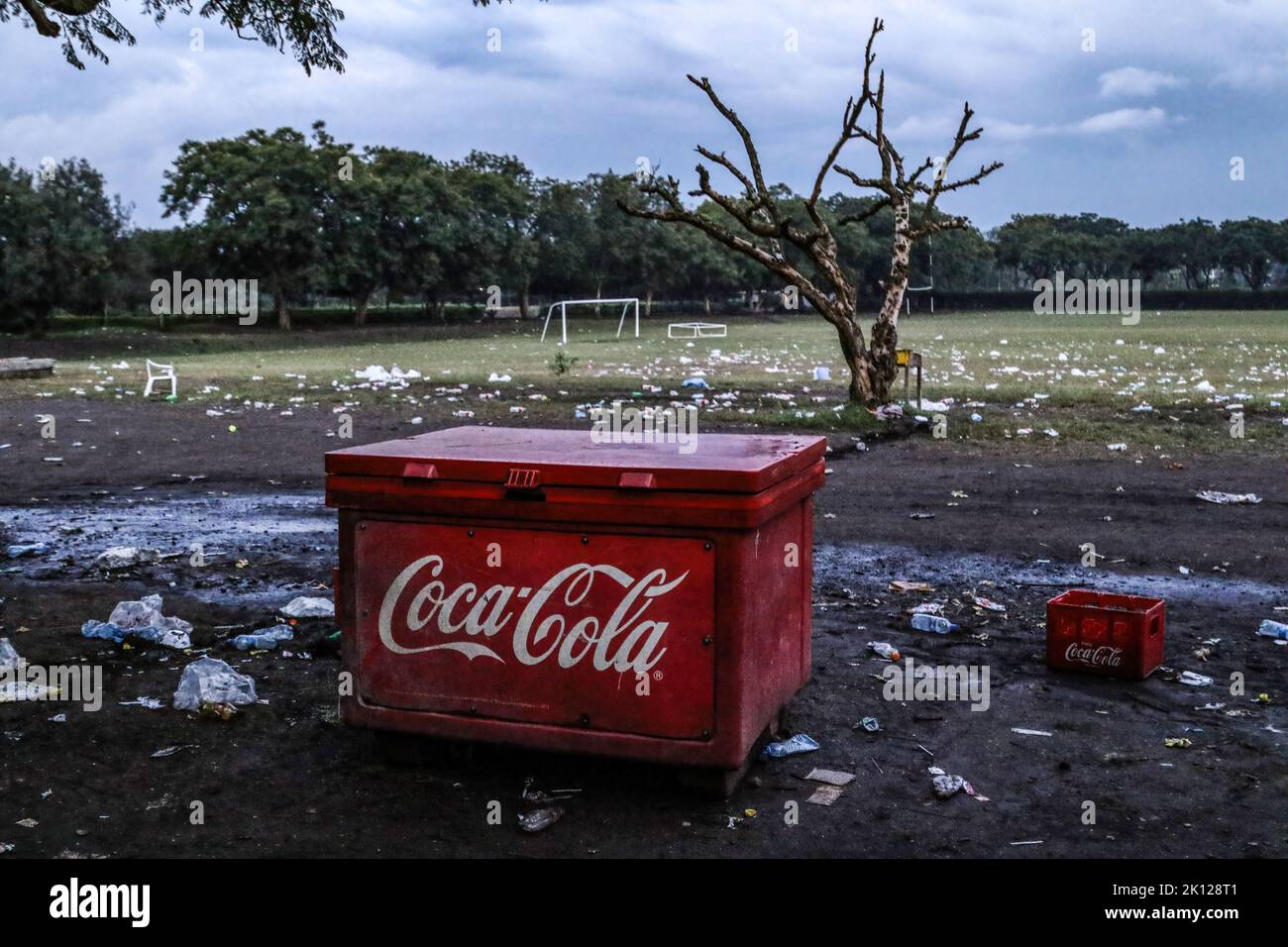 a-coca-cola-branded-cooler-box-and-a-soda-crate-are-seen-at-a-field