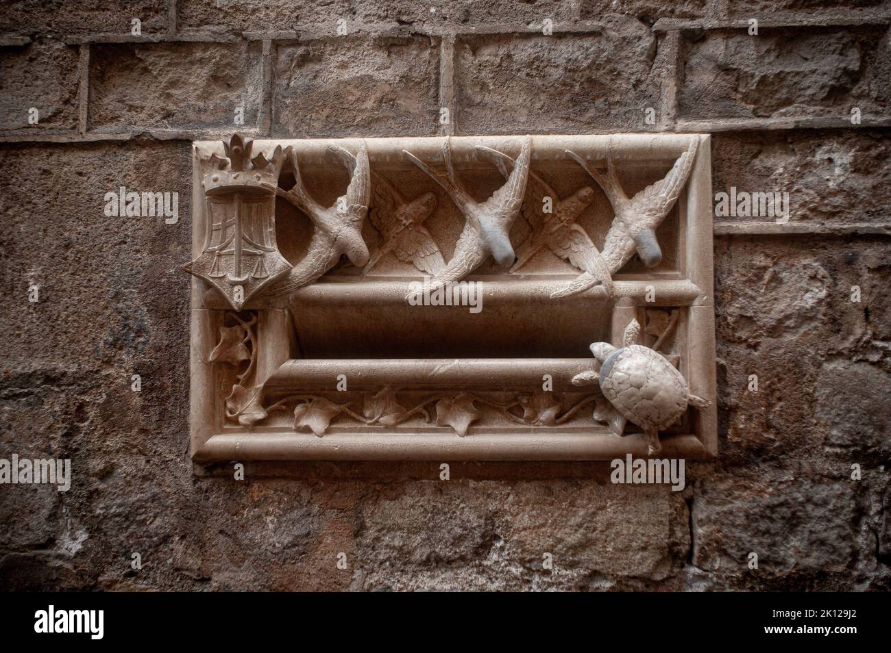 Modernist mailbox sculpted  at the entrance of the historical building Casa de l’Ardiaca in the Gothic Quarter of Barcelona, Catalonia, Spain. Stock Photo