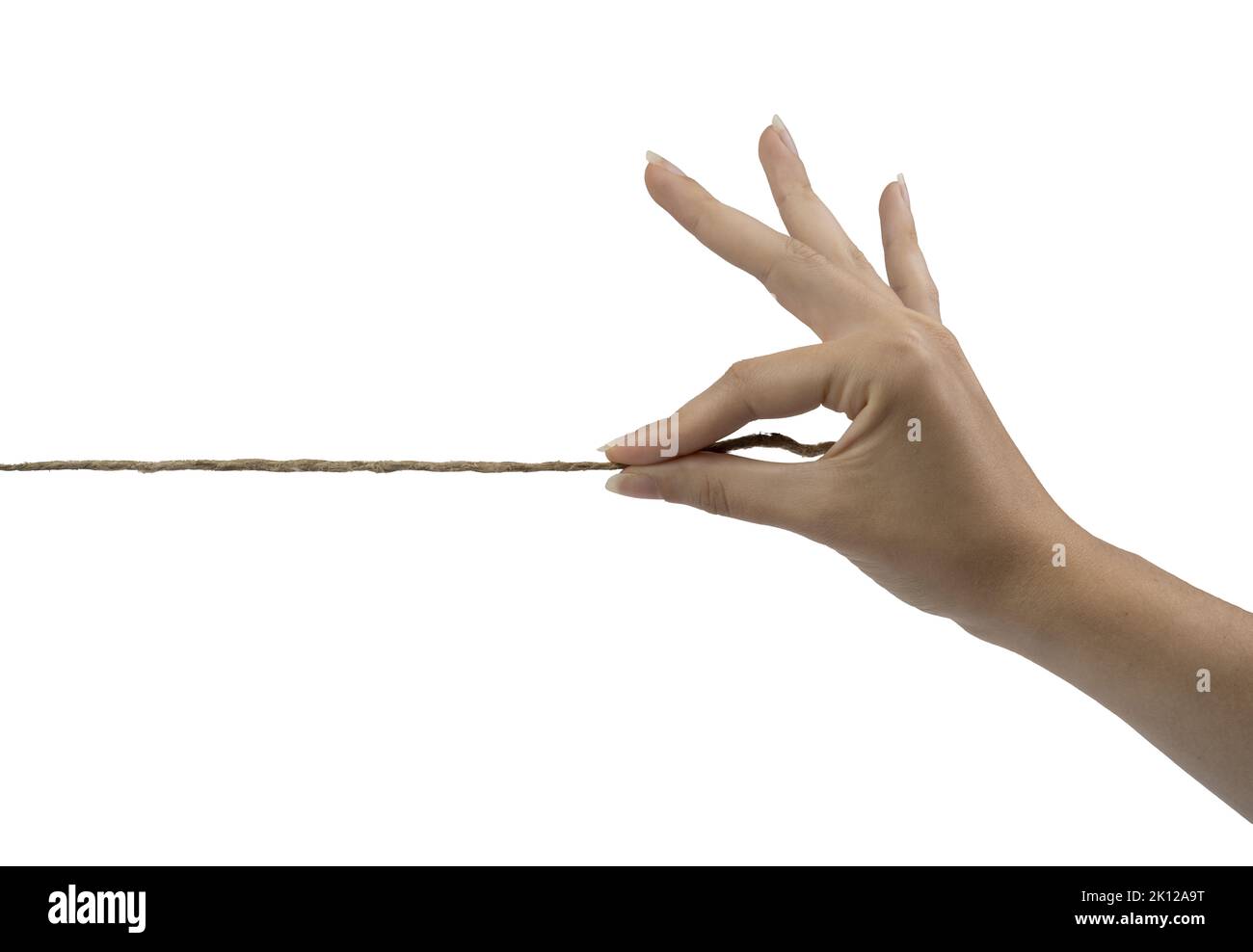 the thread held by a female hand on a white background Stock Photo