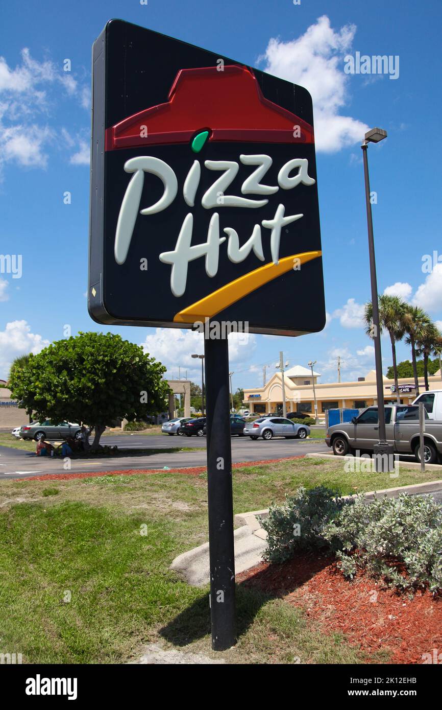 A Pizza Hut pole sign at a restaurant location in Gloversville, NY USA