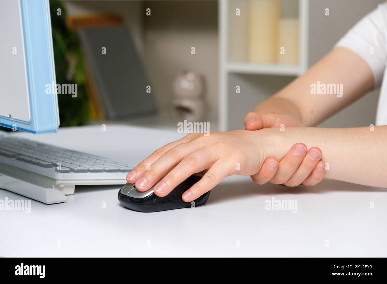 Human hand and computer mouse, carpal tunnel syndrome, wrist pain Stock
