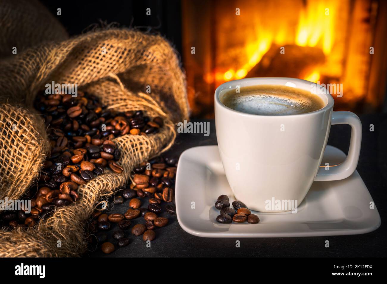 Delicious coffee in front of a fireplace Stock Photo