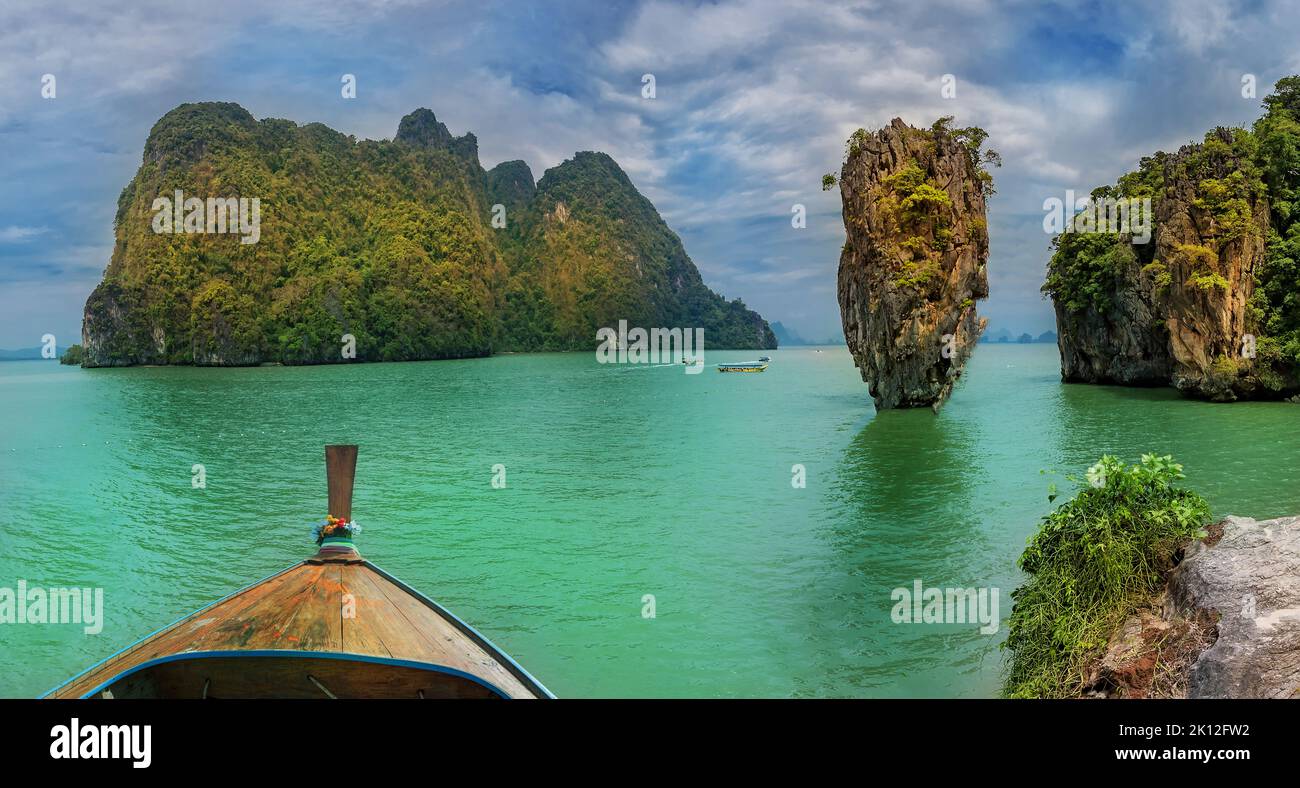View from Tapu small island to the beach and James Bond Island stone landmark in Phangnga Thailand. Stock Photo