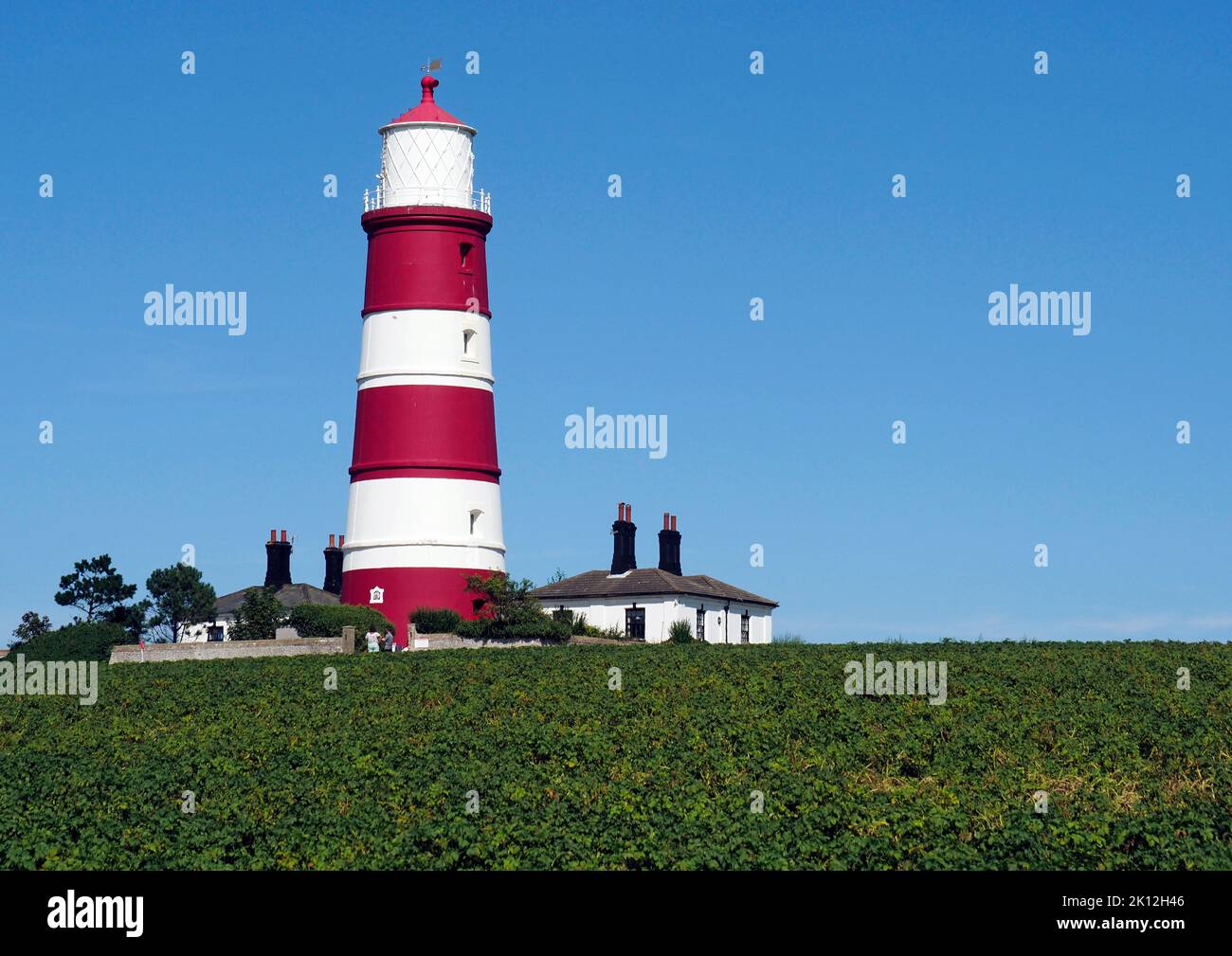 The iconic and much  photographed Haisbro lighthouse on the North Norfolk coast at Happisburgh is independently operated and open to the public. Stock Photo