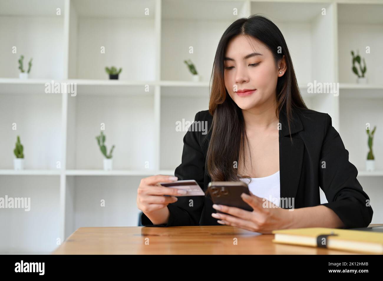 Attractive and beautiful young Asian businesswoman in formal suit at ...
