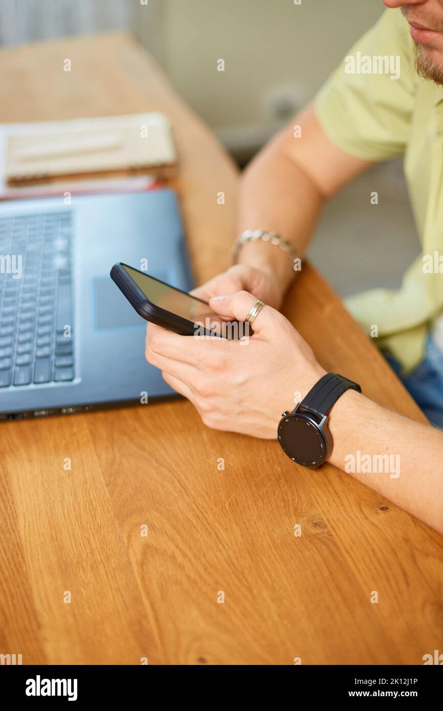 Using Mobile Stock Photo Businessman types on modern keyboard hi-res stock photography and ...