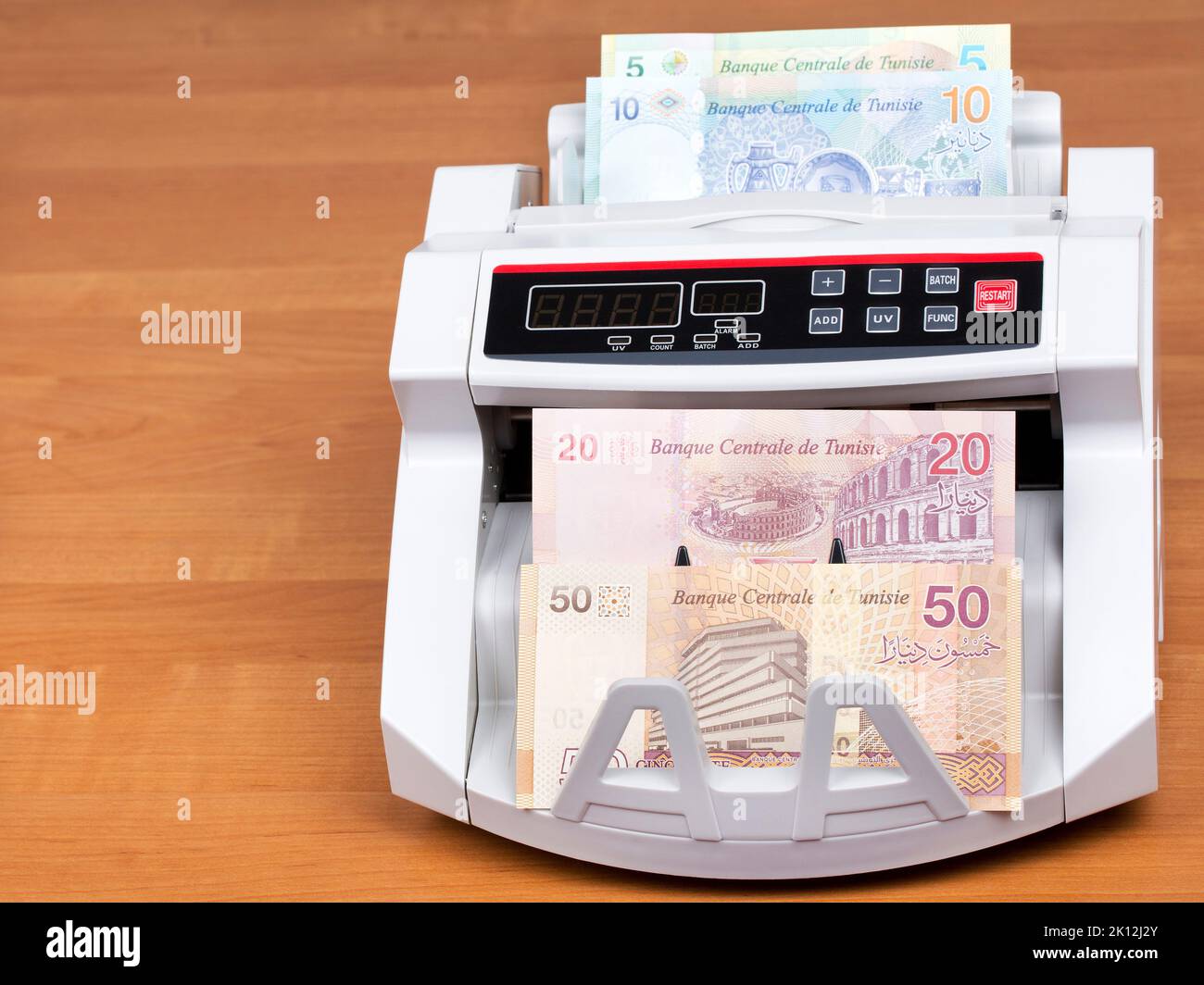 Tunisian money - Dinars in a counting machine Stock Photo