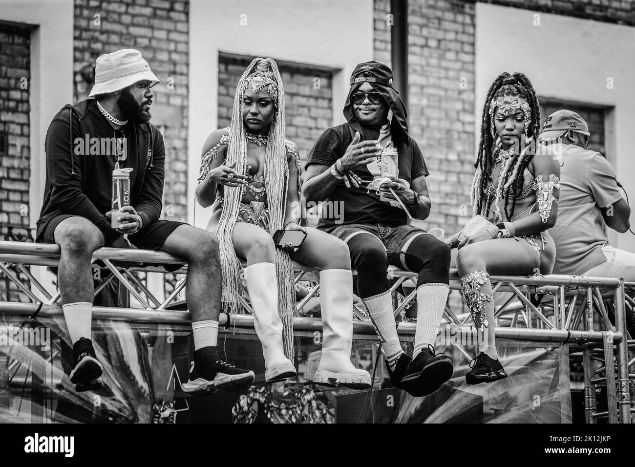 Black and white image of revellers atop a float at the Notting Hill Carnival. Stock Photo