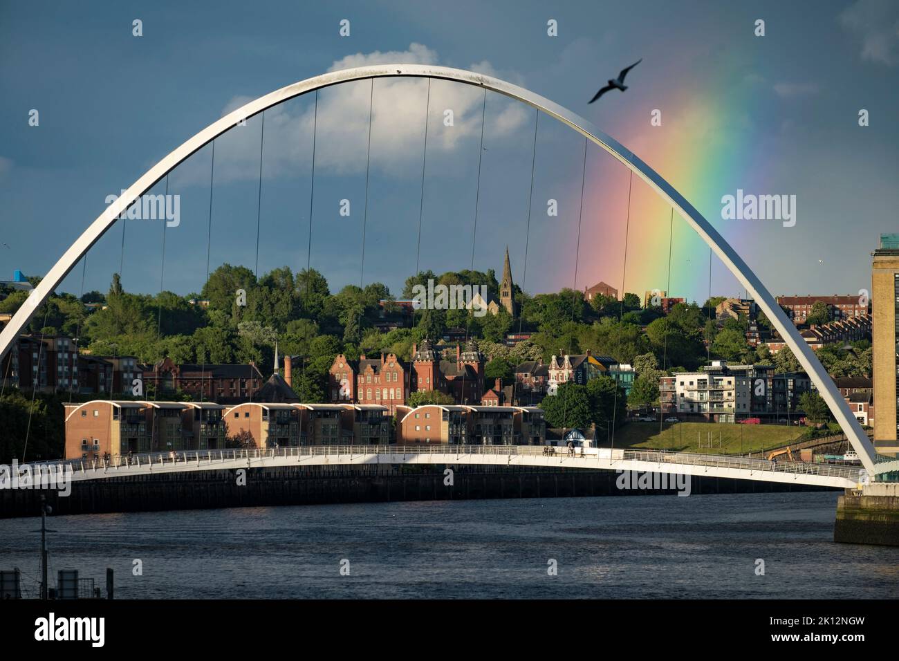 Close shot of Millenium Bridge Gateshead with rainbow over Byker Stock Photo