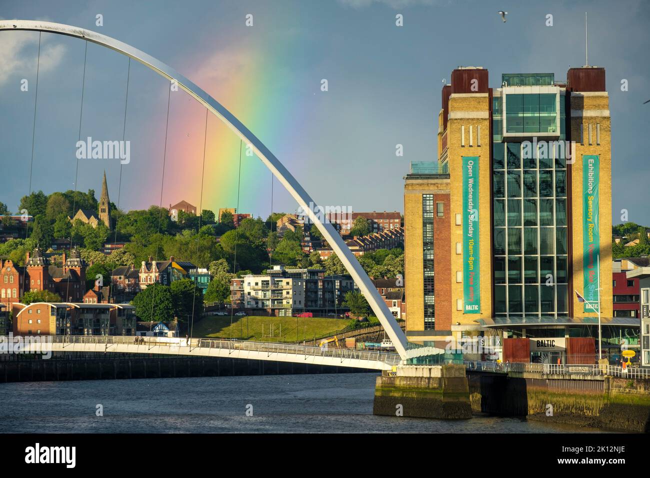 Close shot of Millennium Bridge Gateshead with rainbow and Baltic Mill Stock Photo
