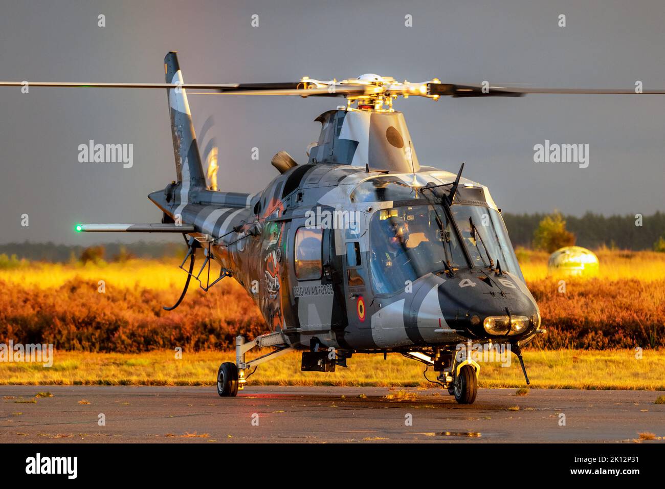 Belgian Air Force Agusta A109 helicopter about to perform during the Sanicole Sunset Airshow. Belgium - September 10, 2022 Stock Photo