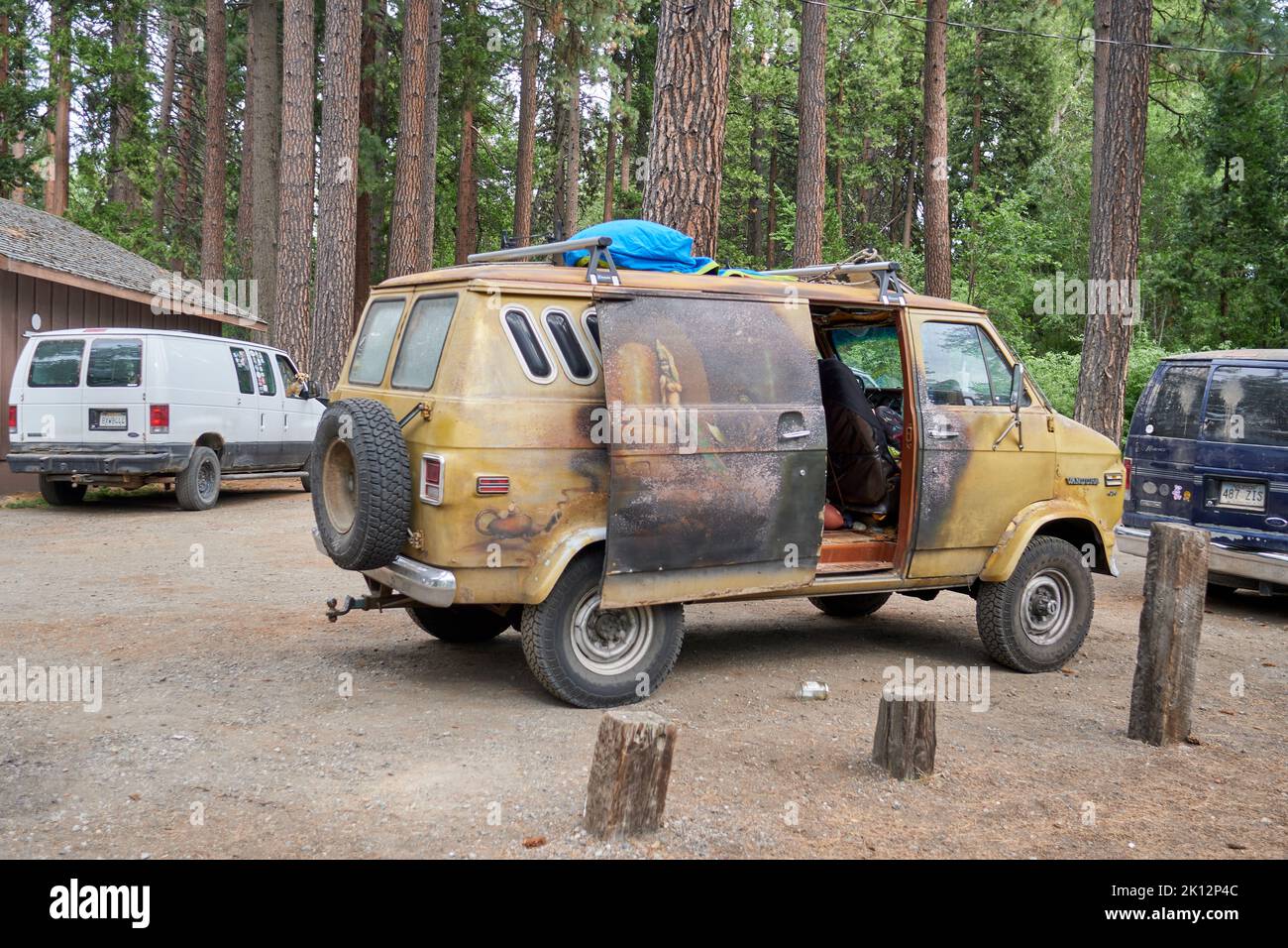 Hippie van with custom art of a woman and the words Egyptian Queen at Mount Shasta, California. Stock Photo