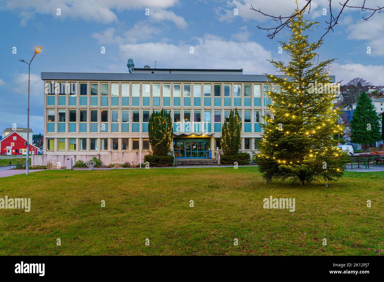 Ulsteinvik city hall with Christmas tree in front. Stock Photo