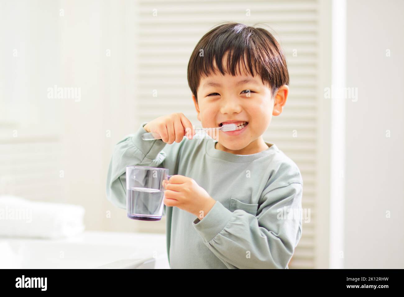 Japanese kid brushing teeth at home Stock Photo Alamy