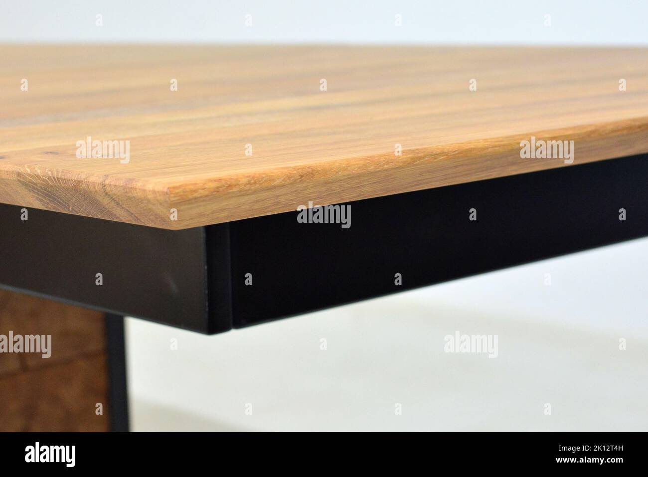 Wooden dinner table surface. Natural wood furniture close view. Solid