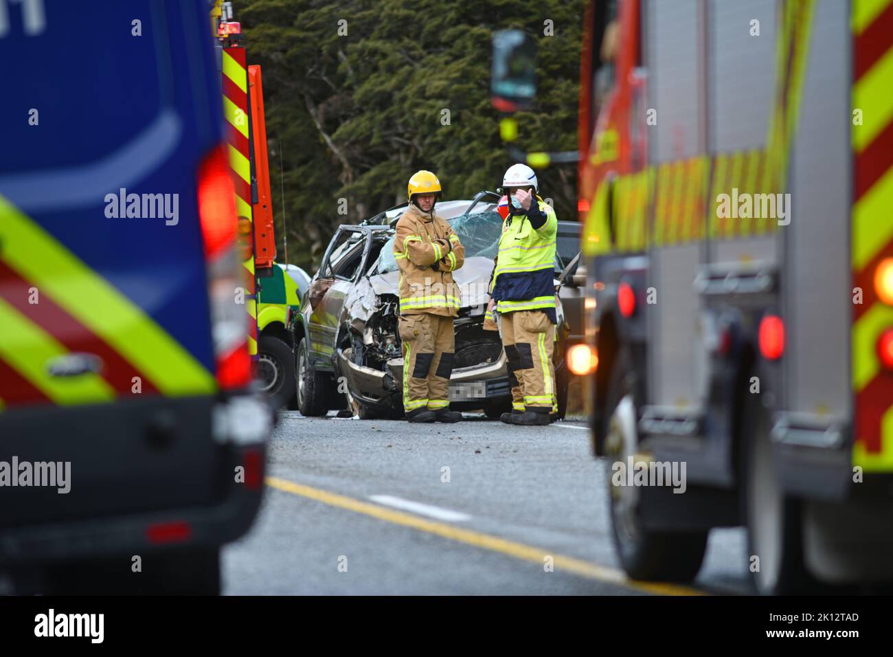 ARTHUR'S PASS, NEW ZEALAND, SEPTEMBER 5, 2022: Emergency teams respond to a single car accident after the driver lost control on black ice on State Highway 73 while crossing the Southern Alps. Grainy image shot in poor morning light. Stock Photo