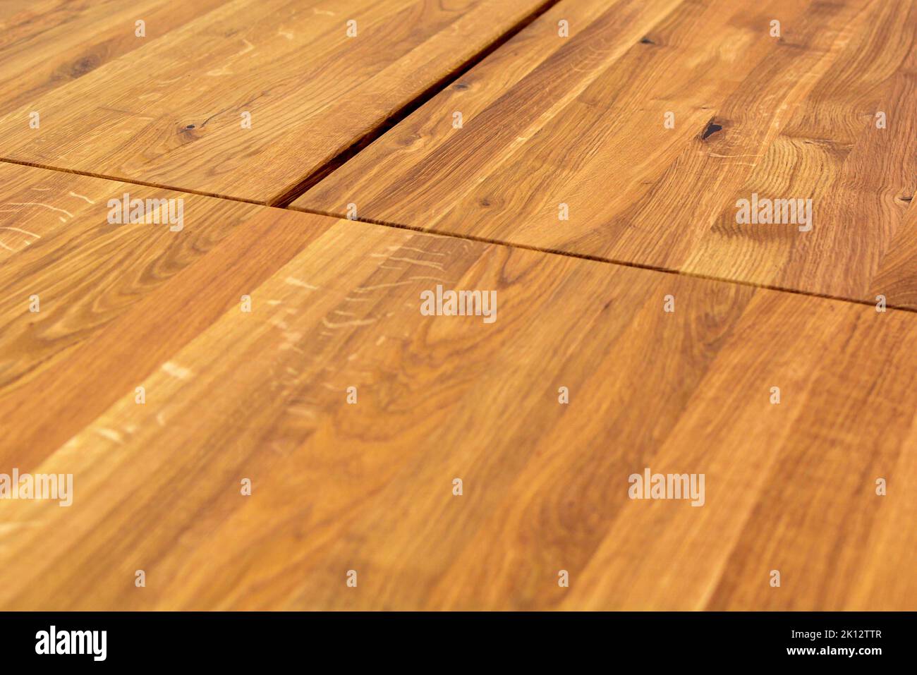 Wooden dinner table surface. Natural wood furniture close view