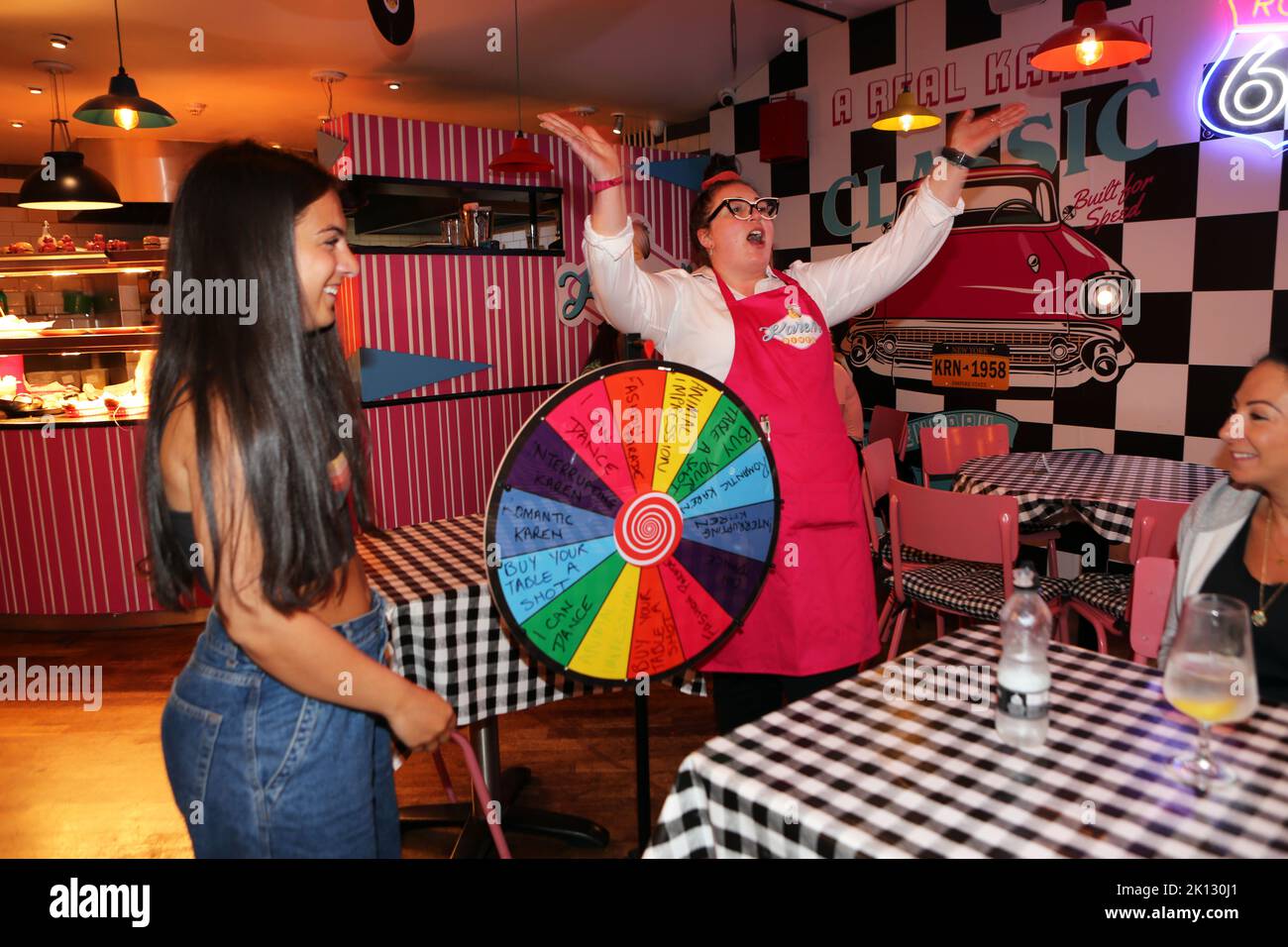The Wheel of Misfortune at Karen’s Diner in Prestwich, Manchester. Karen’s is not for the faint hearted but its the perfect place to dine if you disli Stock Photo