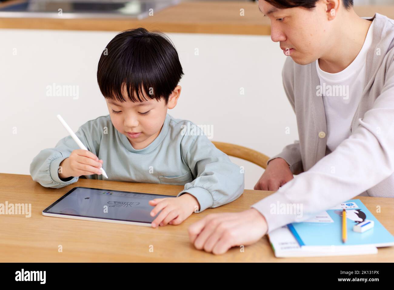 Japanese kid and father studying at home Stock Photo