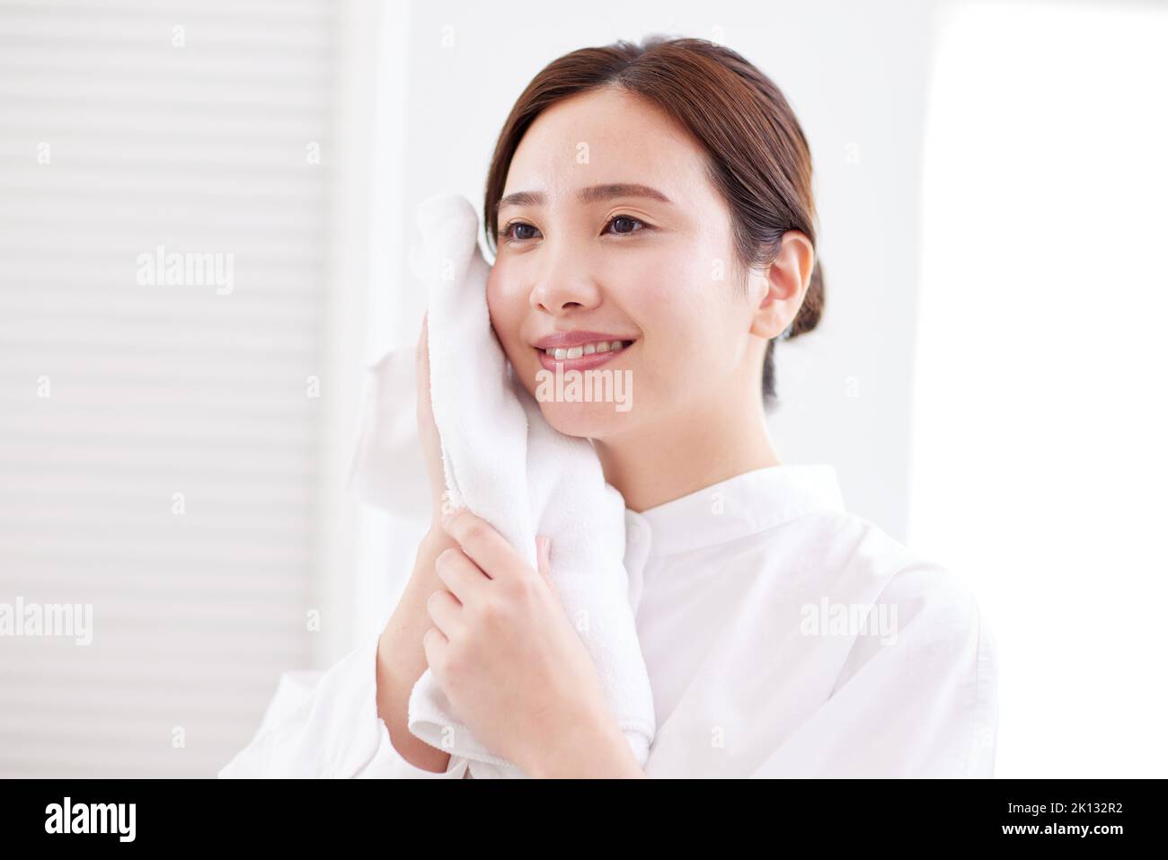 Japanese woman washing face at home Stock Photo Alamy