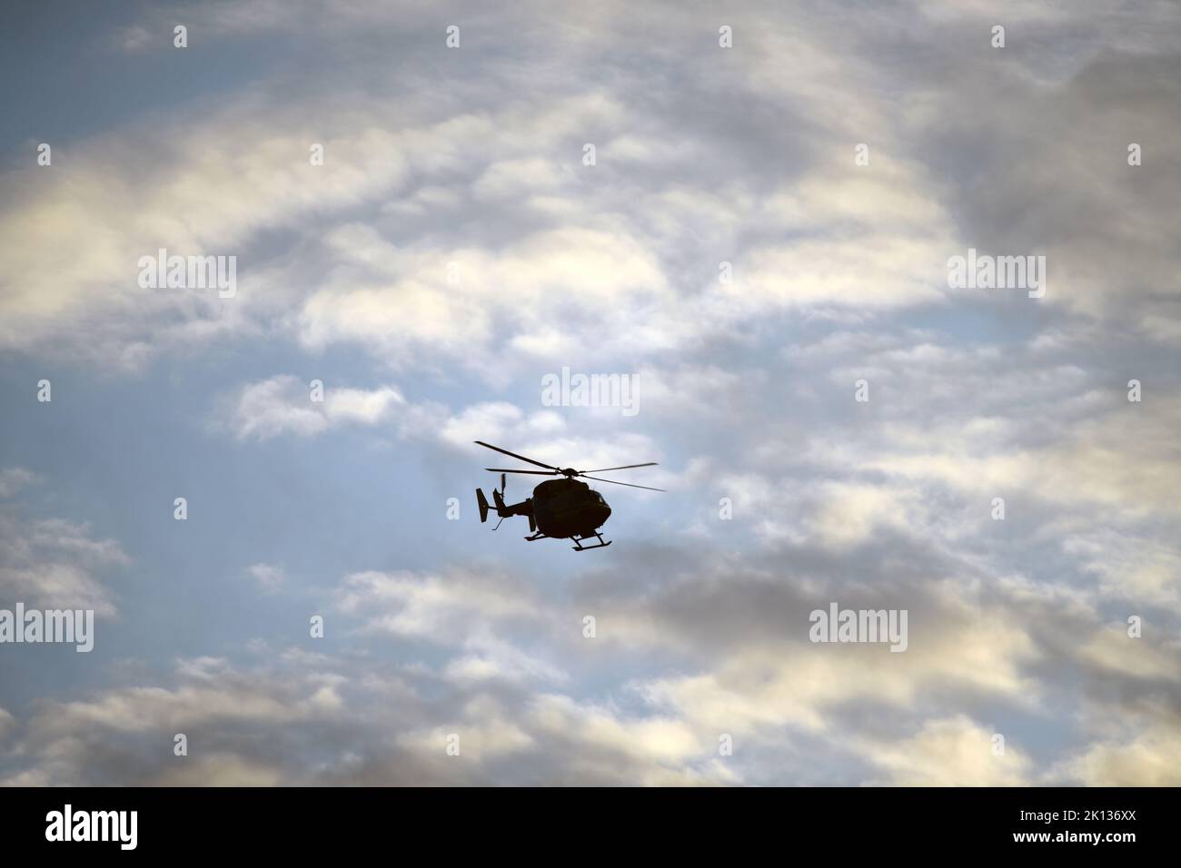 Silhouette of a rescue helicopter about to land at hospital Stock Photo