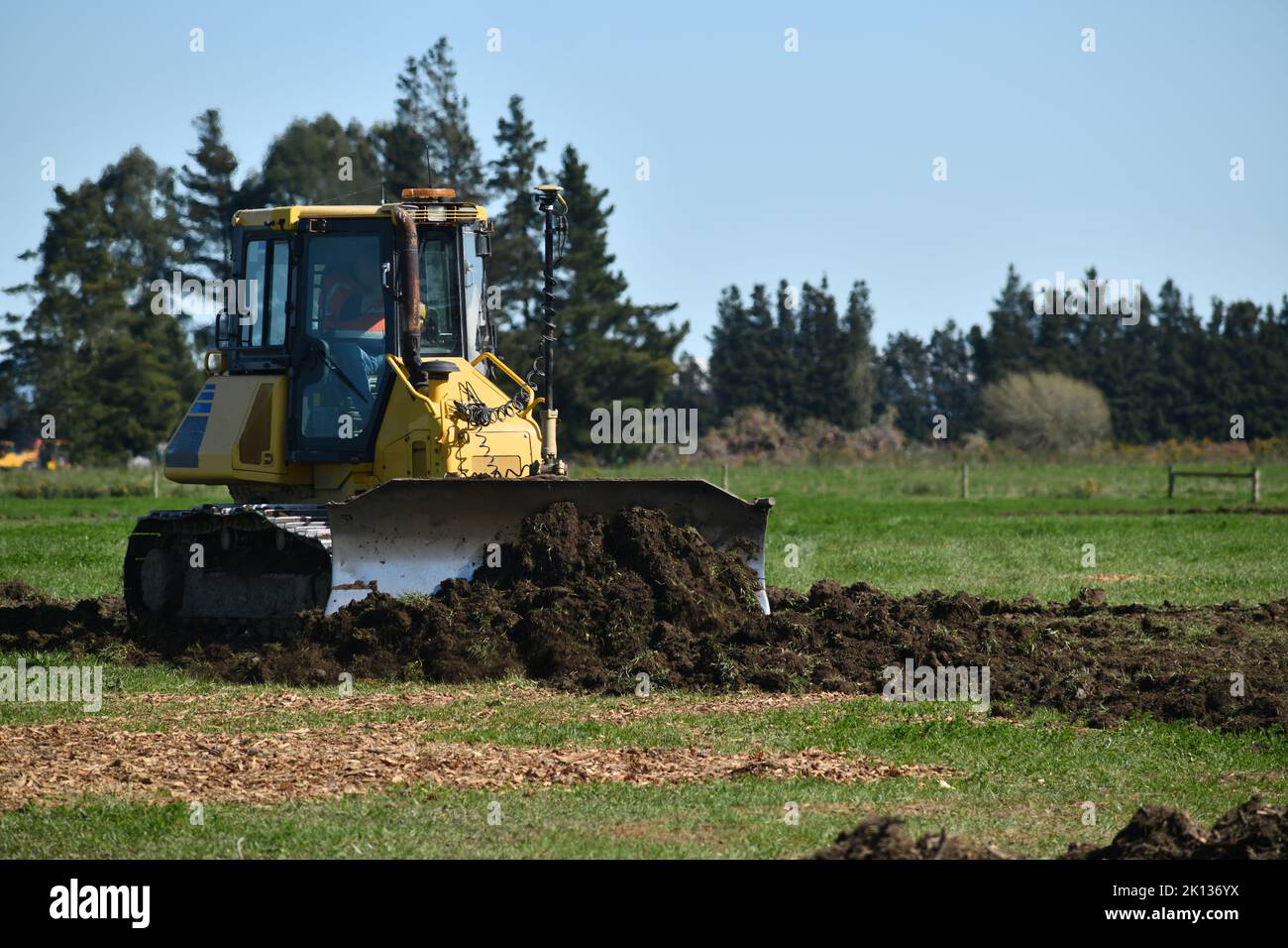 A small bulldozer at work on a property near Darfield, Canterbury, New Zealand Stock Photo