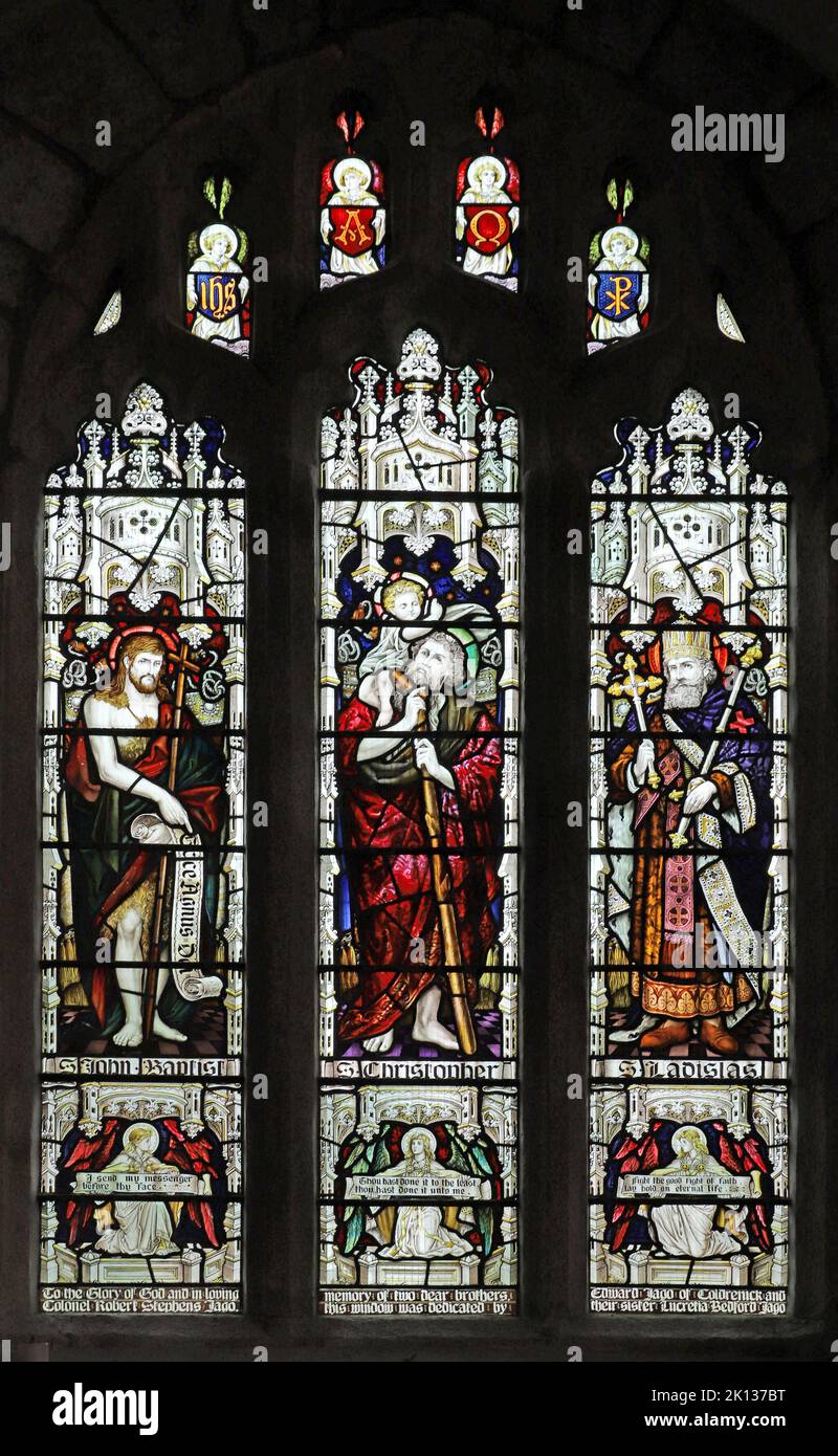 Stained glass window by Fouracre & Son depicting St John Baptist, St Christopher & Ladislas King of Hungary, St Lalluwy's Church, Menheniot, Cornwall Stock Photo