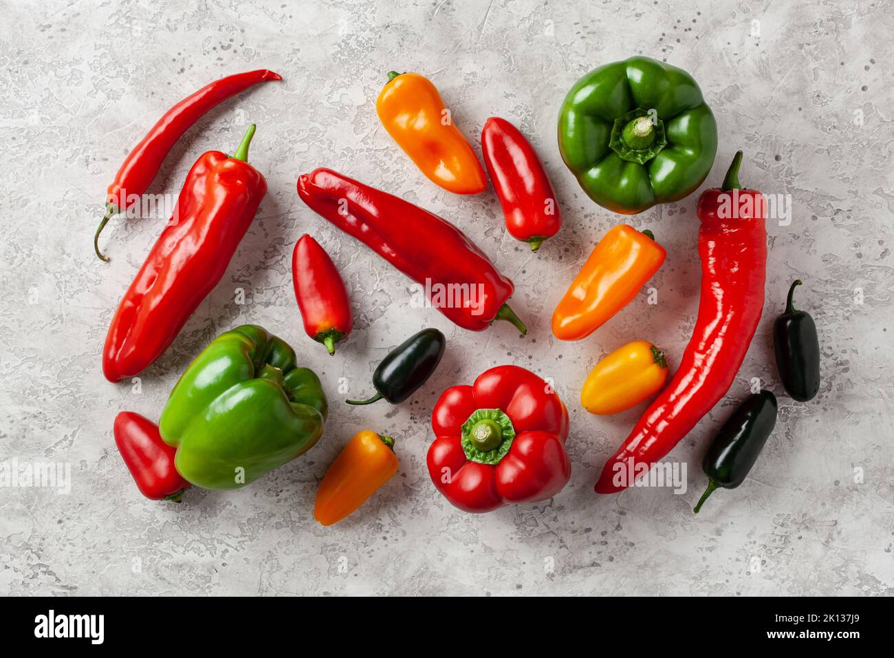 assorted red green and yellow bell peppers vegetables chili habanero Stock Photo