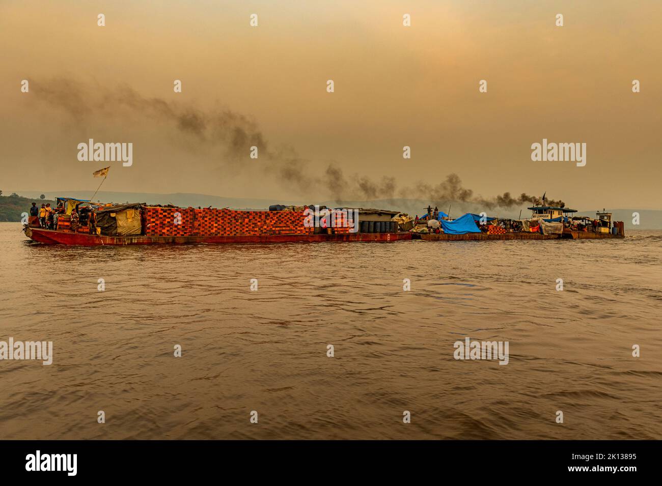 Overloaded riverboat on the Congo River at sunset, Democratic Republic of the Congo, Africa Stock Photo