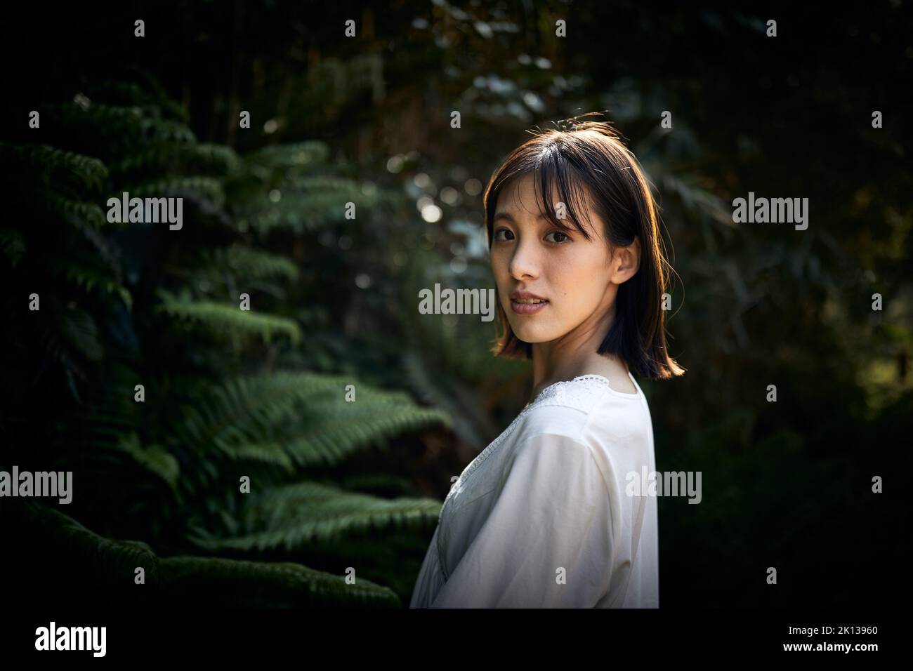 Japanese woman in a forest Stock Photo