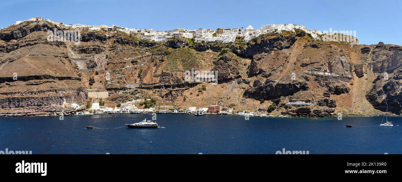 Wall of the Minoan caldera, with town of Thira (Fir) perched on rim, Santorini, Cyclades, Greek Islands, Greece, Europe Stock Photo