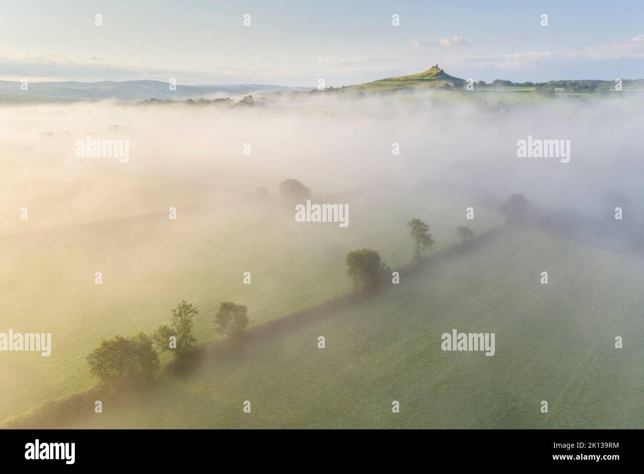 Aerial view over mist shrouded countryside towards Brentor Church, Dartmoor National Park, Devon, England, United Kingdom, Europe Stock Photo