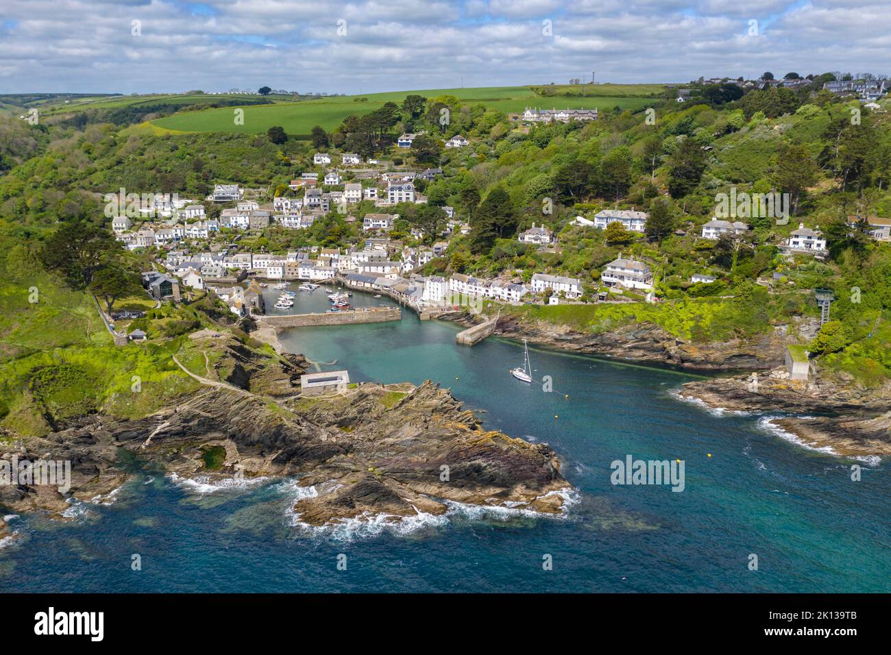 Aerial view of Polperro fishing village and harbour on a sunny spring afternoon, Cornwall, England, United Kingdom, Europe Stock Photo