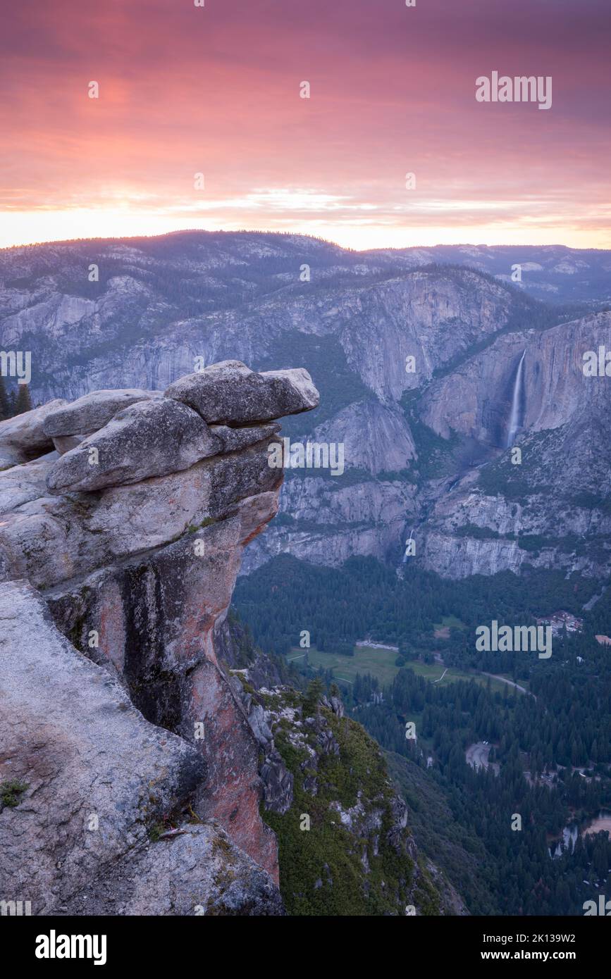 Pink sunset sky above Yosemite Valley from Glacier Point, Yosemite National Park, UNESCO World Heritage Site, California, United States of America Stock Photo