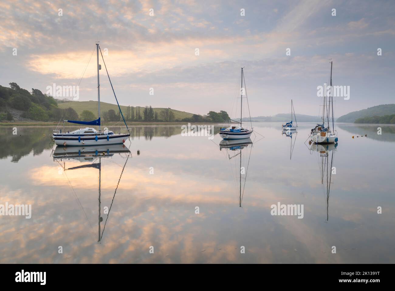 Sailing boats moored on the River Tiddy at dawn in spring, St. Germans, Cornwall, England, United Kingdom, Europe Stock Photo