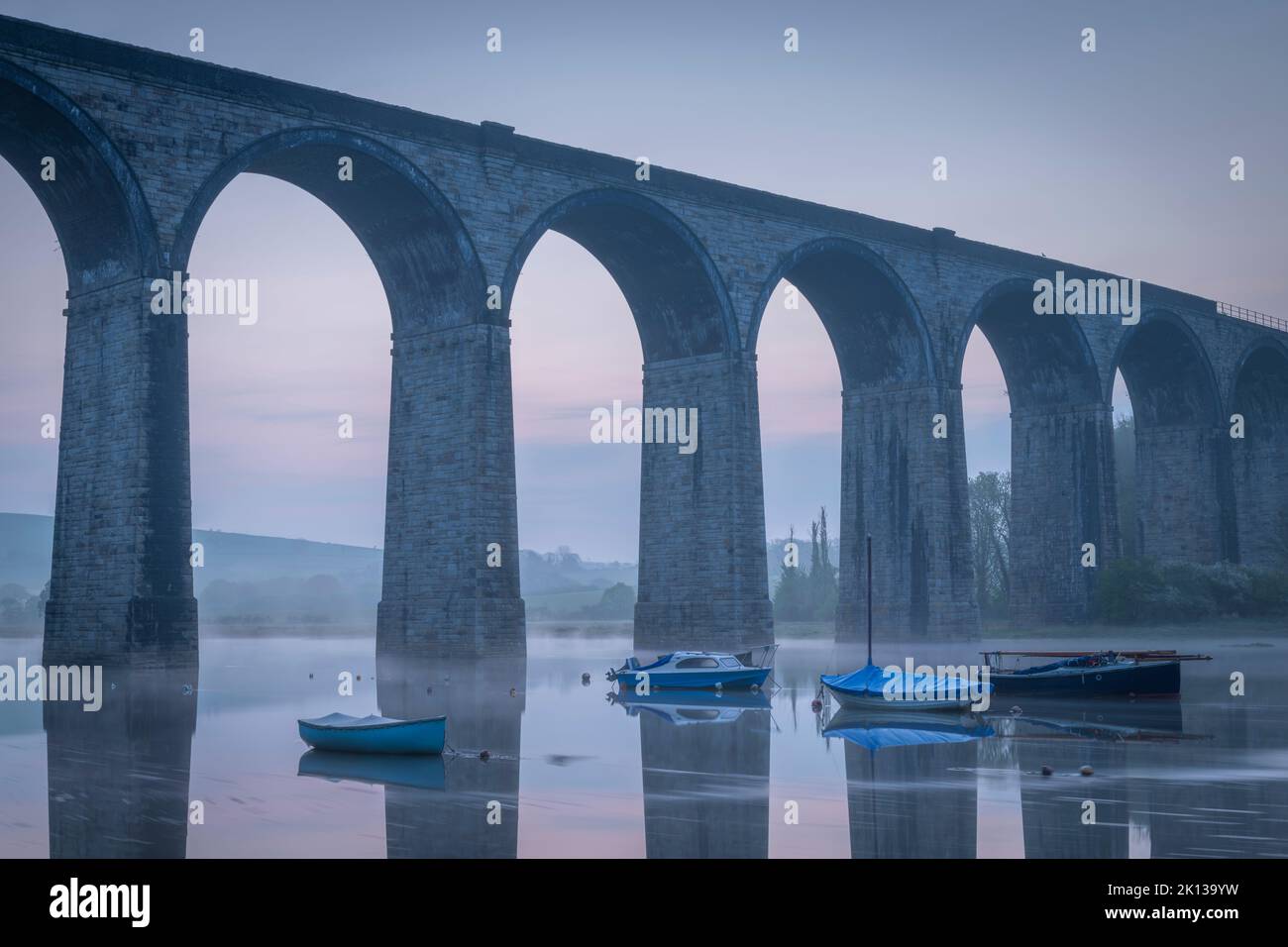 Boats beneath St. Germans Victorian viaduct at dawn, St. Germans in Cornwall, England, United Kingdom, Europe Stock Photo