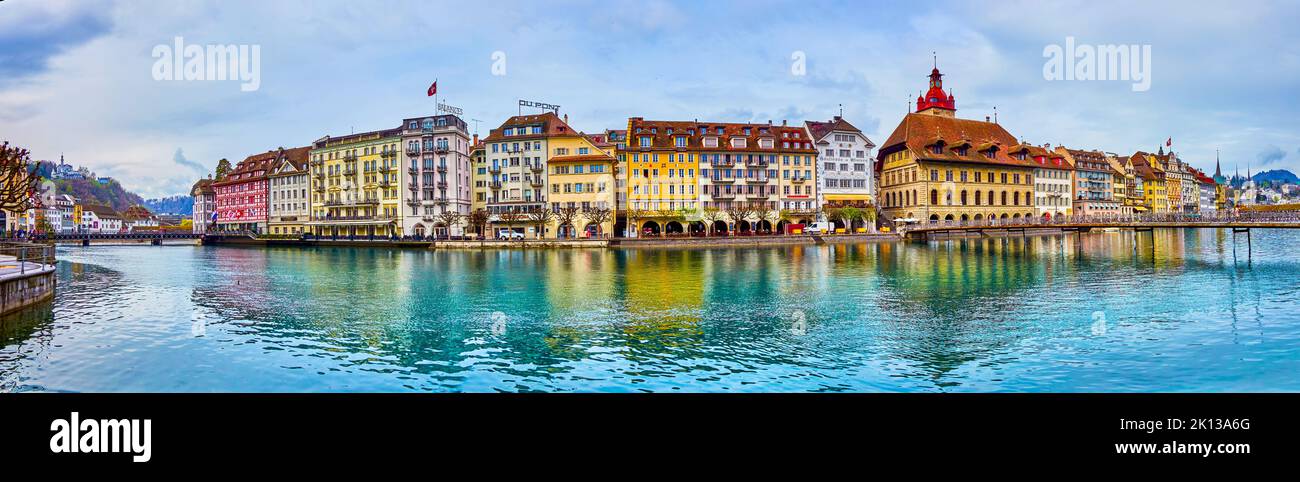LUCERNE, SWITZERLAND - MARCH 30, 2022: Panorama of Altstadt of Lucerne with gorgeous buildings on its embankment, on March 30 in Lucerne, Switzerland Stock Photo