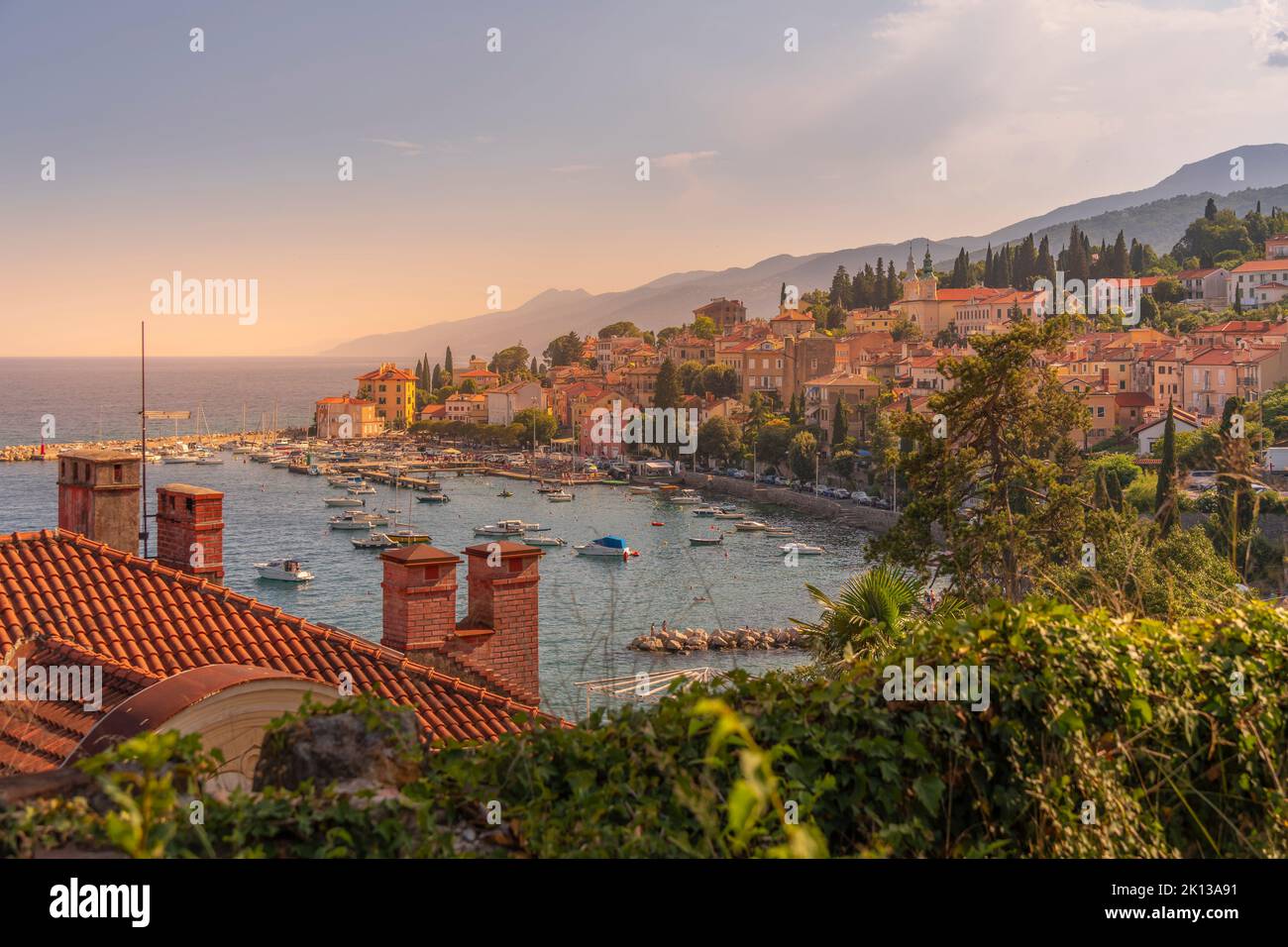 View of marina, rooftops and bay from elevated position in Volosko, Opatija, Kvarner Bay, Croatia, Europe Stock Photo